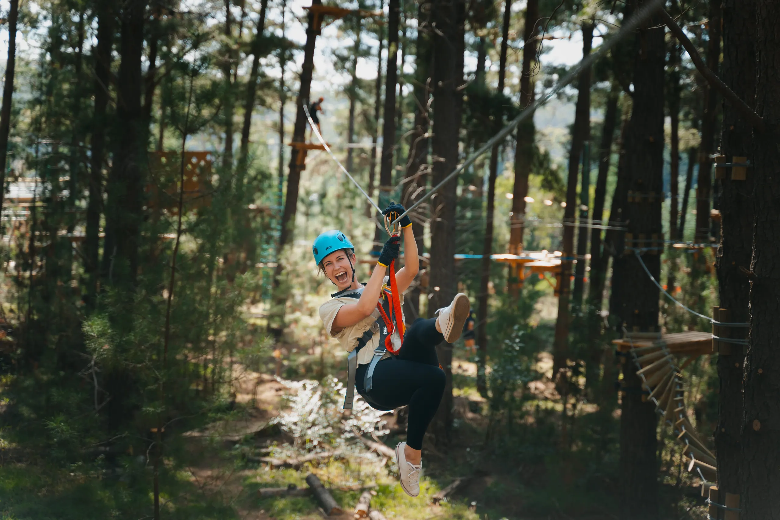 Model on a zipline at Treetops Canberra