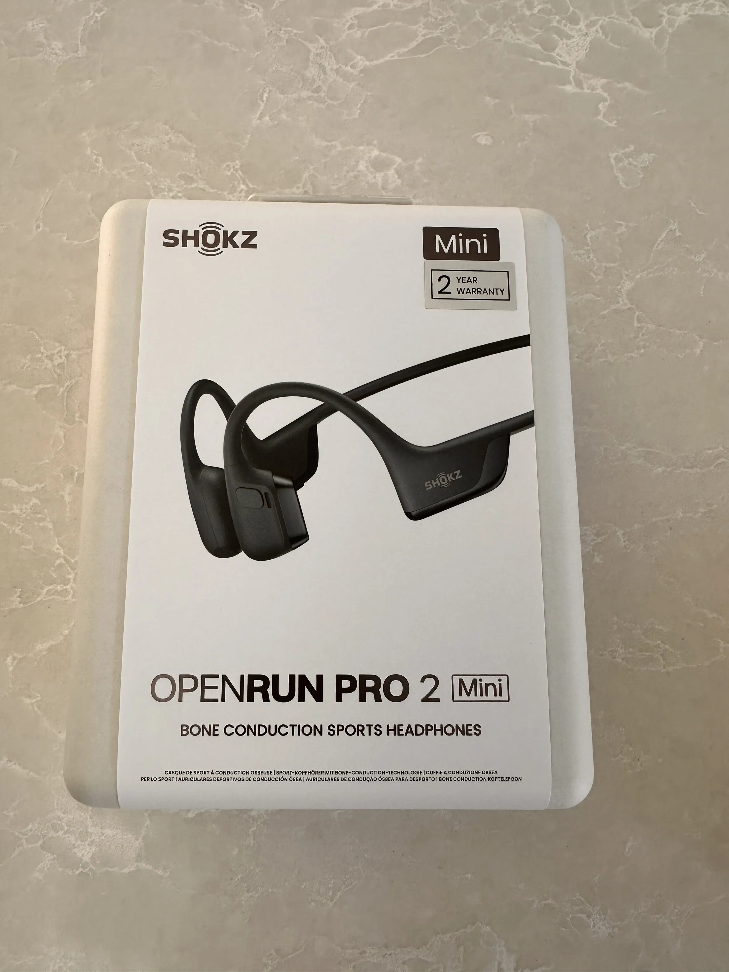 Shokz OpenRun Pro 2 Mini bone conduction headphones in the box