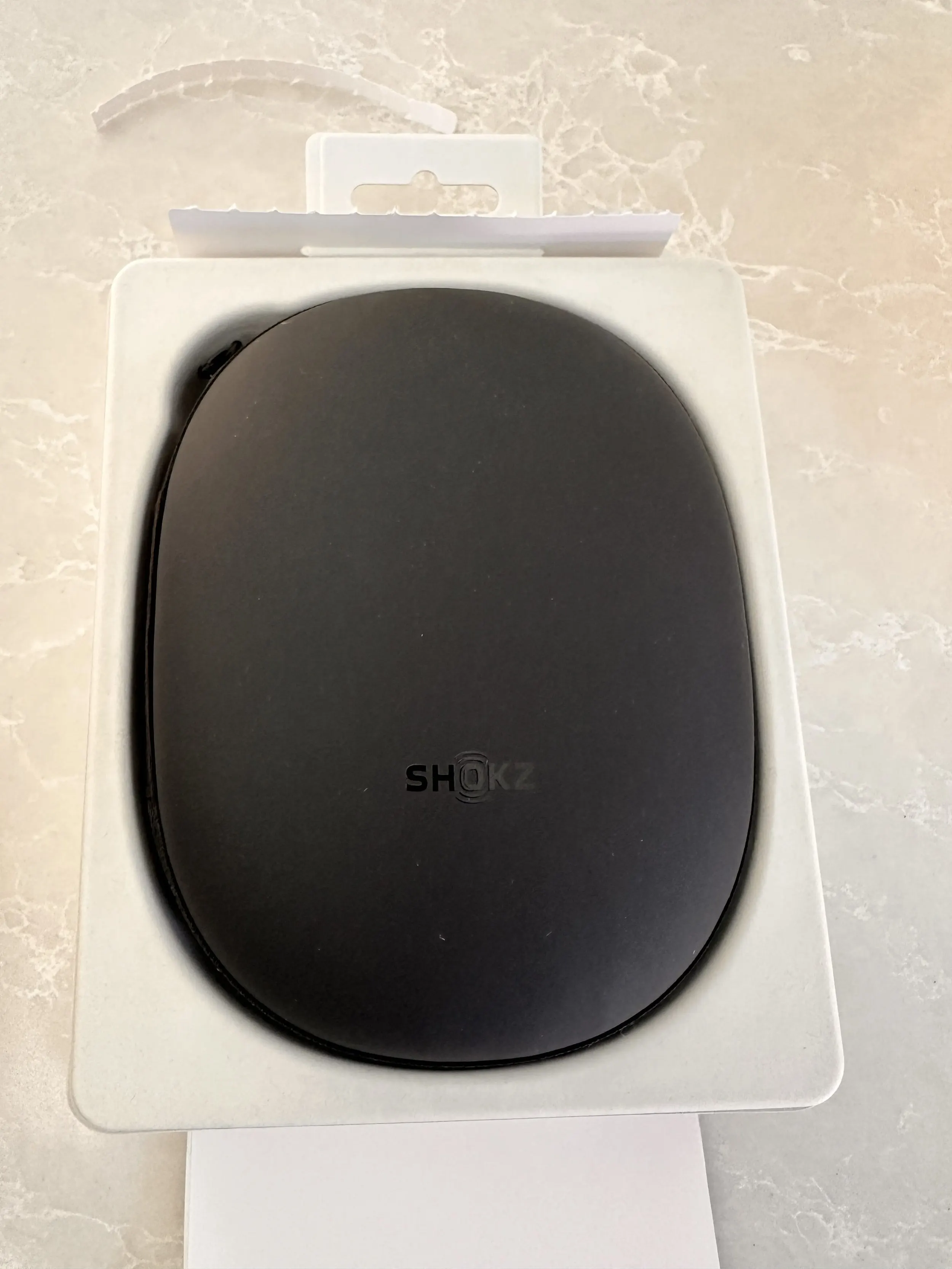 Shokz zip carry case inside the OpenRun Pro 2 packaging