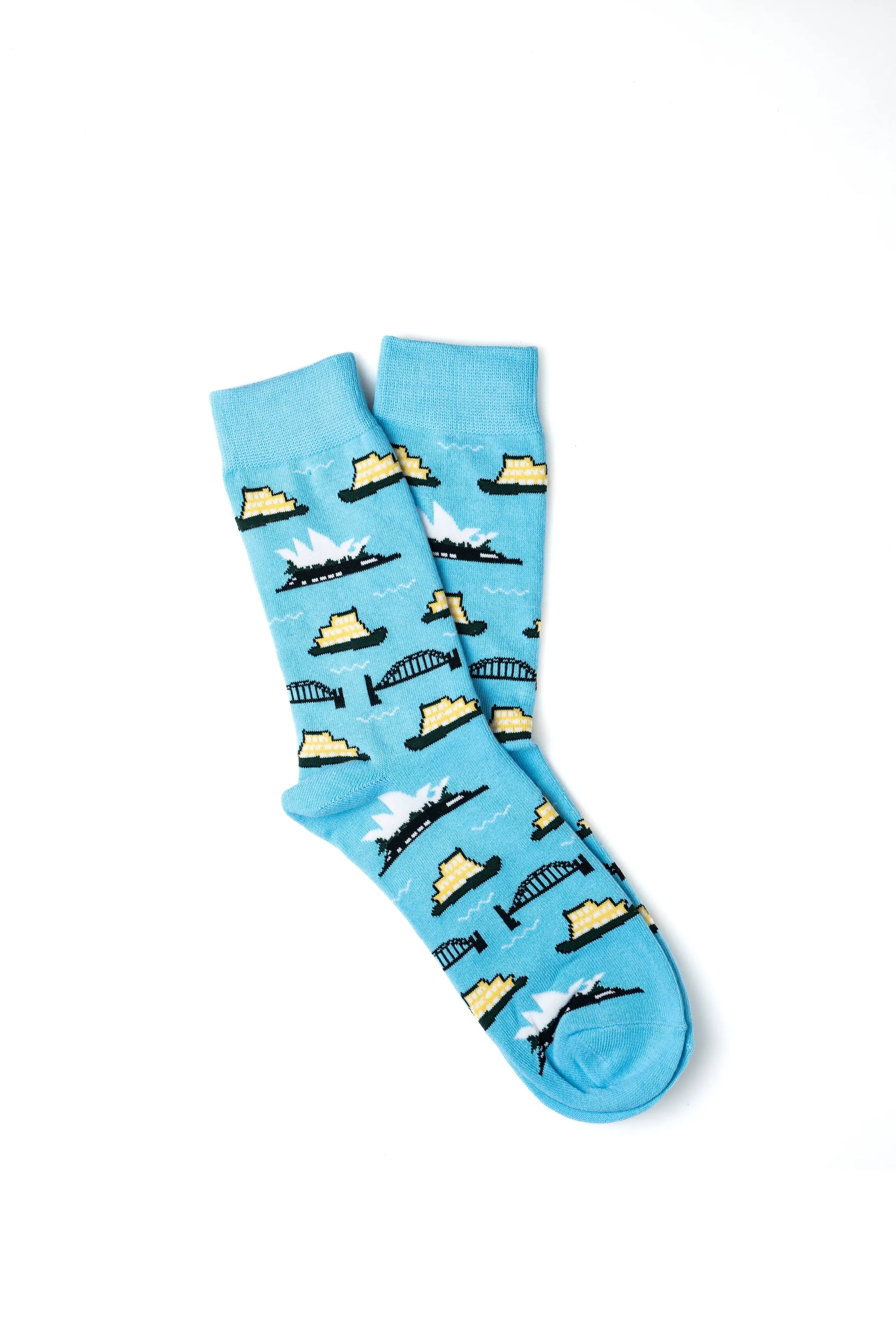 Pair of light blue socks with pixelated nautical scene including ships, bridges, and water waves.