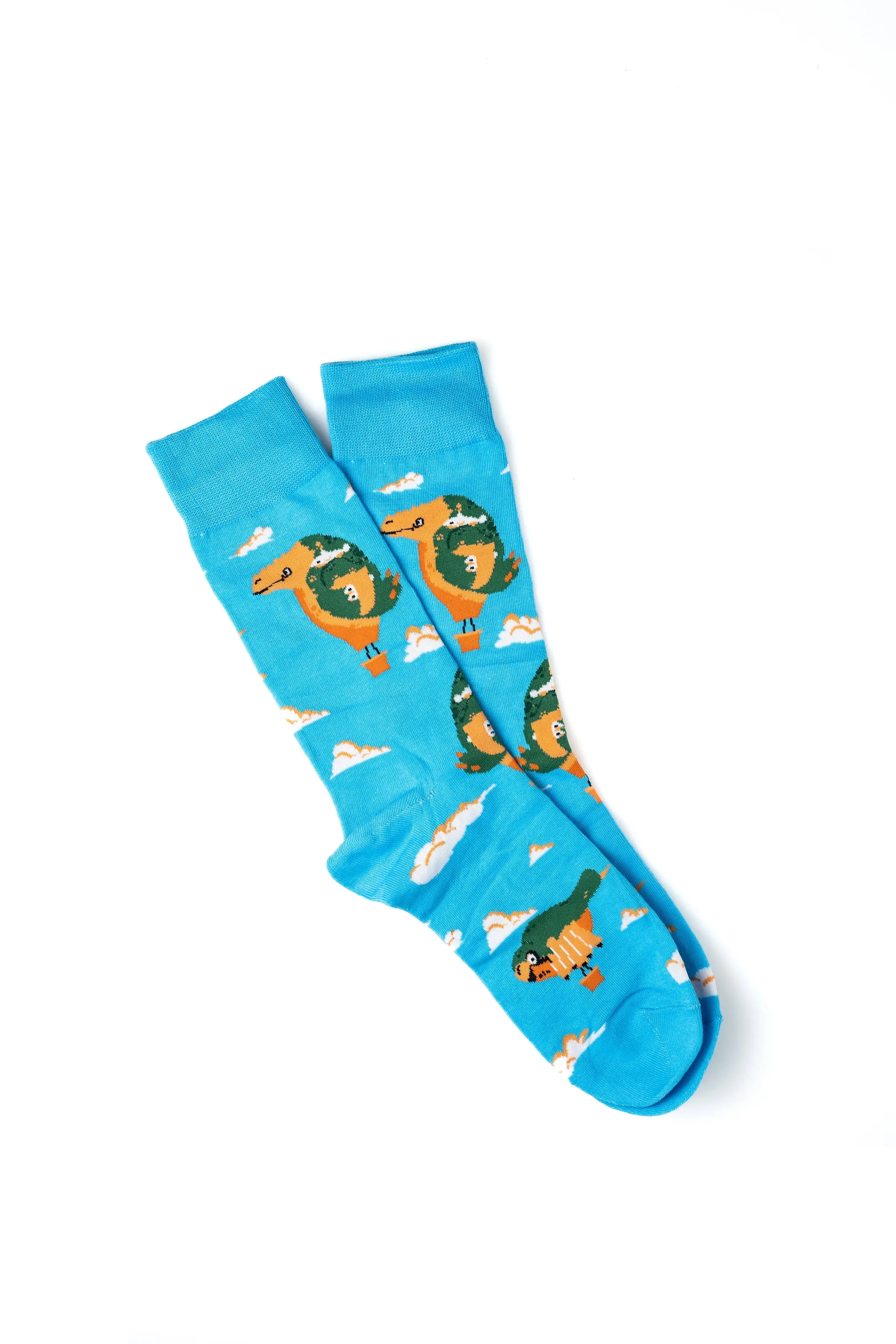 Blue socks with a design of flying dragons and clouds.