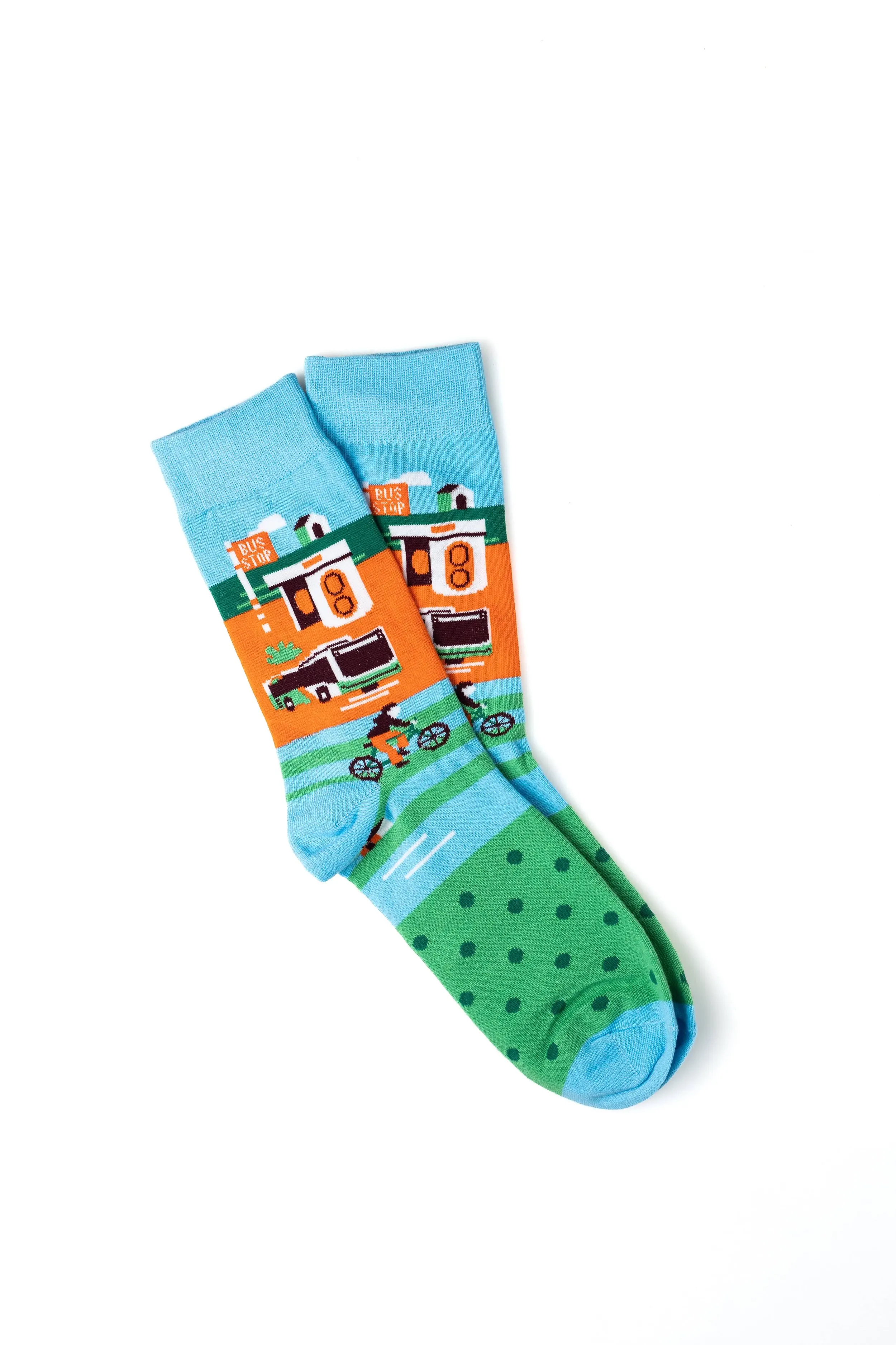 Colorful socks featuring a fishing scene with a boat, water, a dog, and trees.