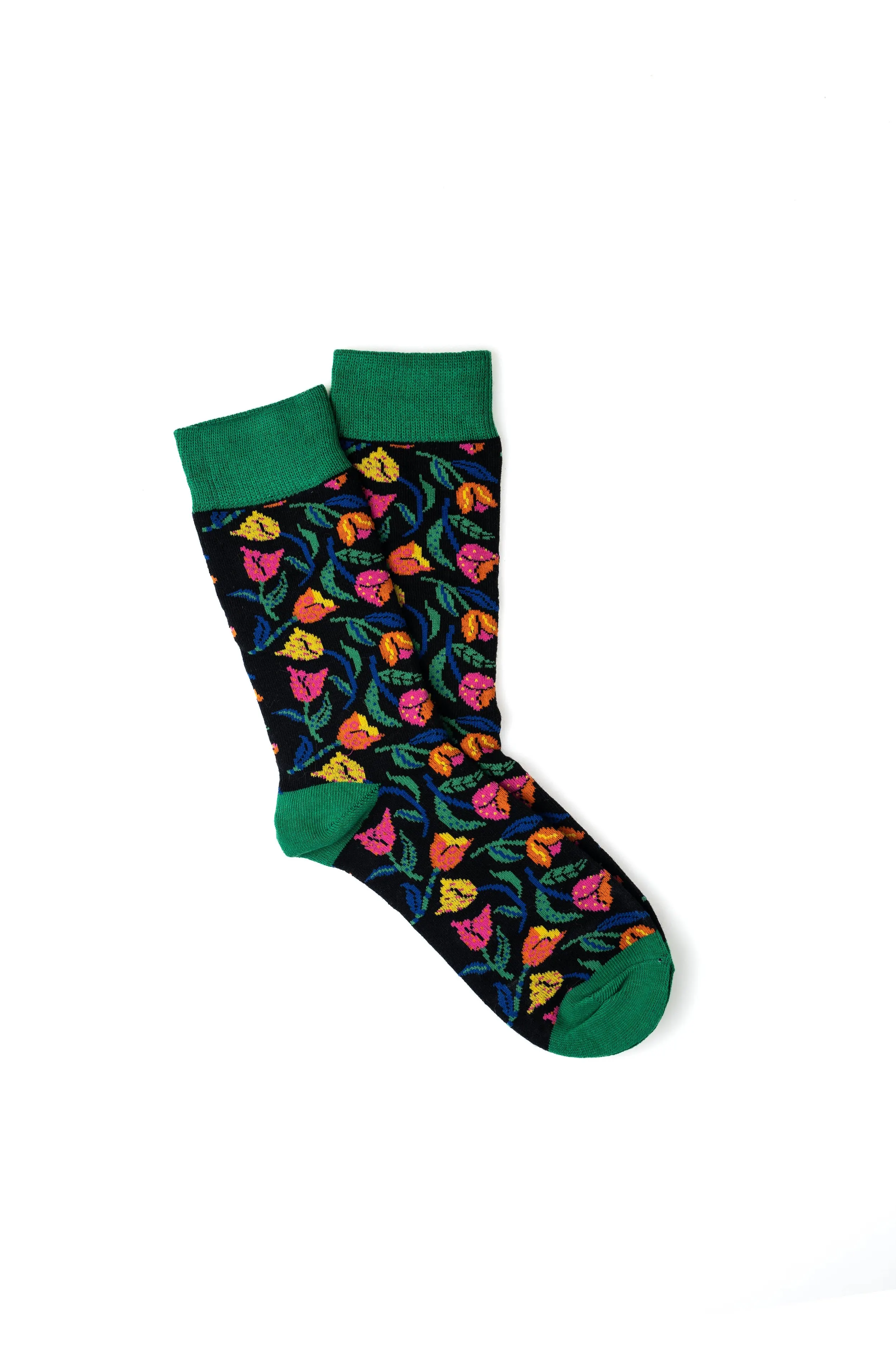 Pair of black socks with colorful floral pattern and green cuffs, heel, and toe.