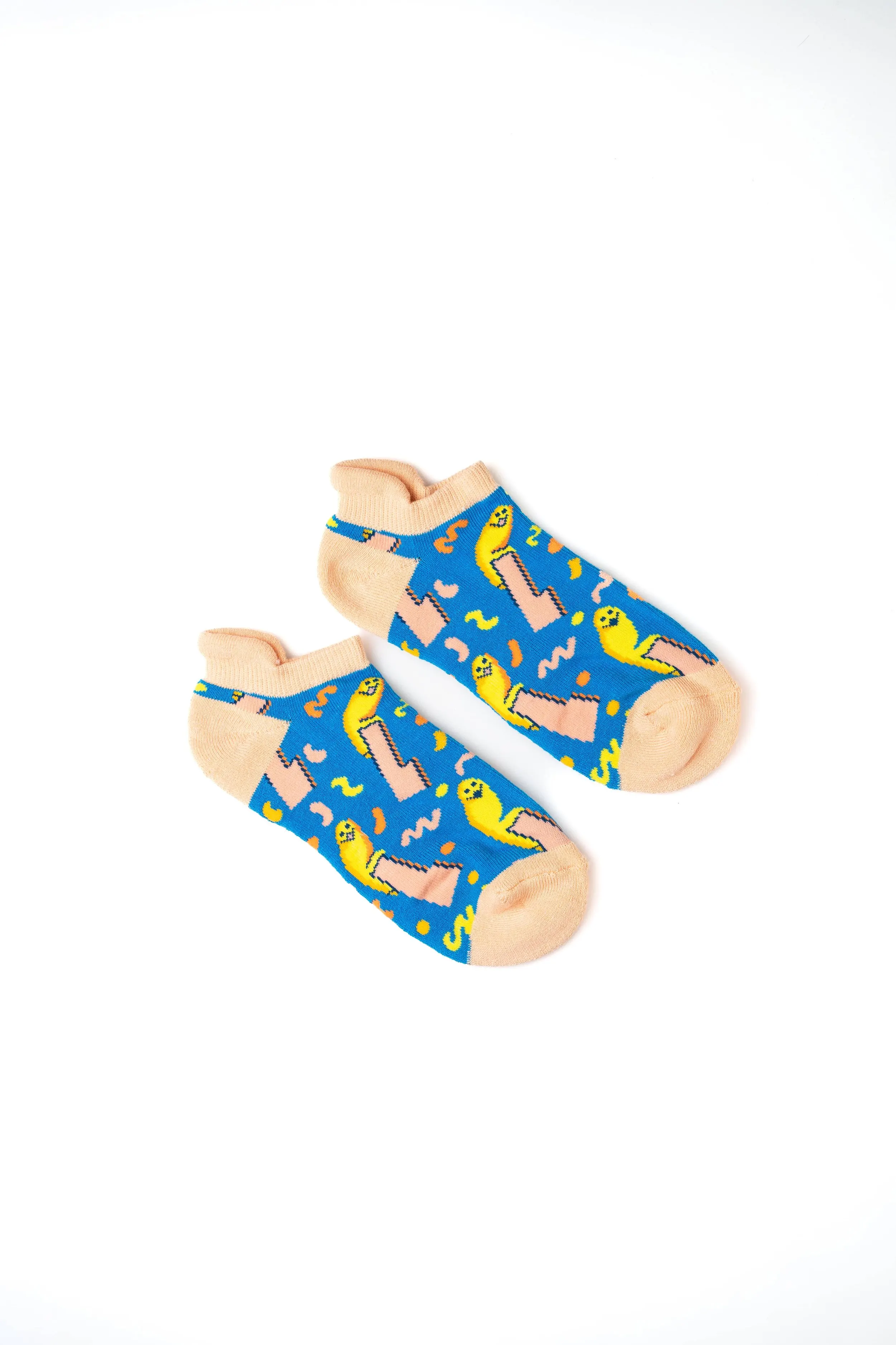 Pair of colorful children's socks with a dinosaur pattern on a white background.
